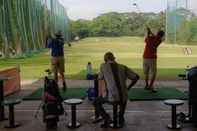 Golfers at Mandai Executive Golf Course's driving range on Saturday. National water agency PUB developed the nine-hole course and driving range as a community project in 1992, and it began operations in 1993. The course is currently operated by Poh B