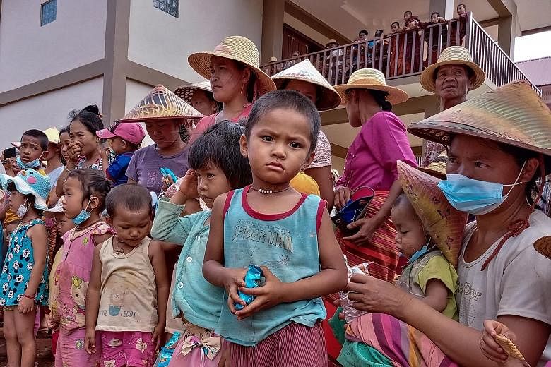 People displaced by fighting between government troops and ethnic rebels awaiting food distribution last month at a monastery in Myanmar's eastern Shan state. The news coming out of the country is not good - inflation has spiked, economic activity is