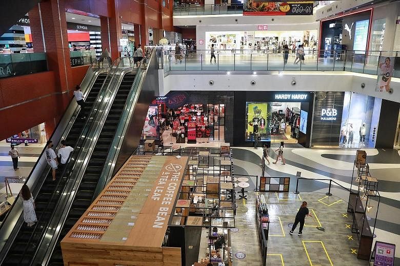 Low footfall at the normally busy Bugis+ mall yesterday, with the two-person cap on social group sizes still in force. Singapore's total number of Covid-19 cases now stands at 62,276.