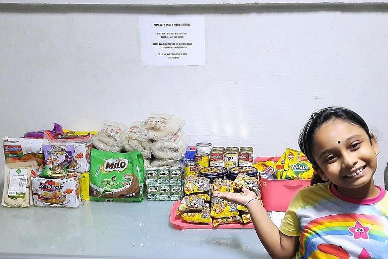 Shakthipriya Saravanan, seven, has set up a "Share And Care" corner in her neighbourhood to provide free groceries to anyone who needs them.