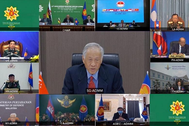 Defence Minister Ng Eng Hen (centre) and his counterparts at the 15th Asean Defence Ministers' Meeting held virtually yesterday. The ministers also reaffirmed their commitment to a swift recovery from Covid-19.