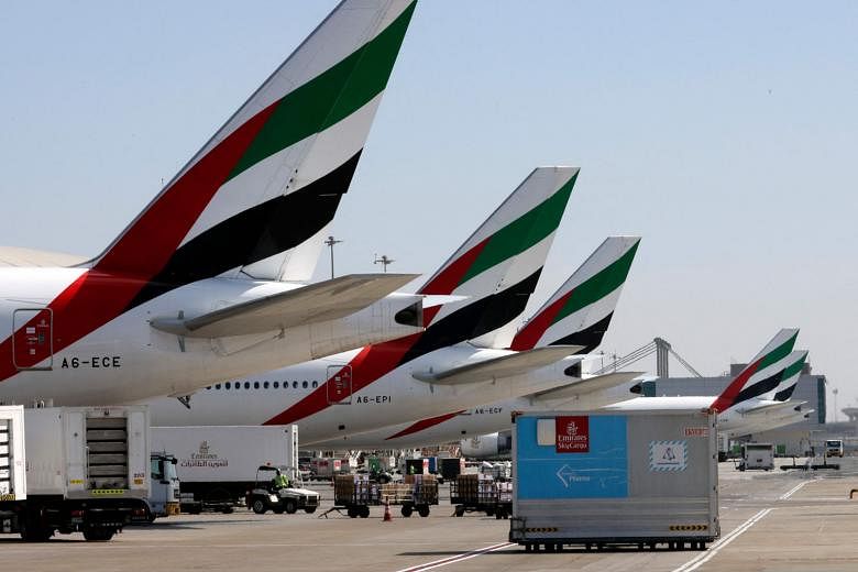 An Emirates Airlines plane unloading a coronavirus vaccine shipment in Dubai in February. The carrier's Boeing 777s are struggling with lower passenger loads and mainly transporting cargo.