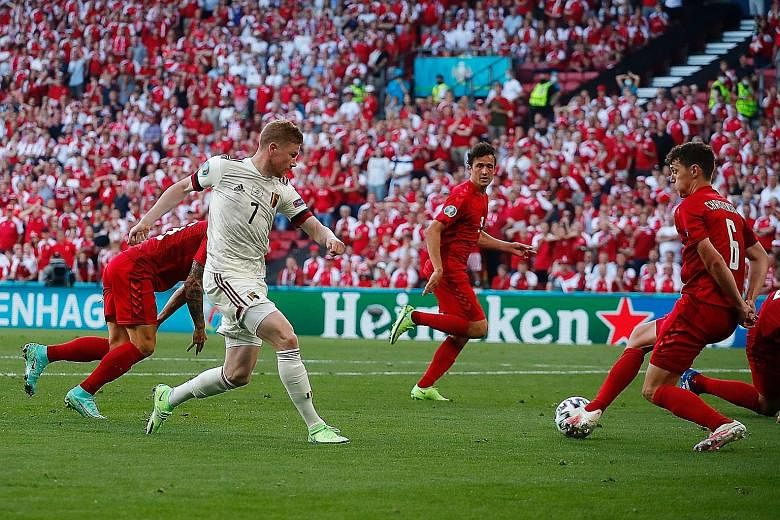 Kevin de Bruyne (in white) came off the bench at half-time to record a goal and an assist as Belgium beat Denmark 2-1 on Thursday to reach the last 16 at Euro 2020.