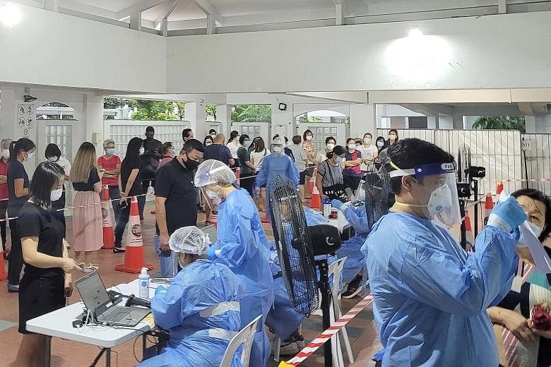 Mandatory swab testing under way in Tiong Bahru yesterday. Tenants and workers at several places in the neighbourhood have to be tested for Covid-19 after infections were detected among people in the area. PHOTO: SHIN MIN DAILY NEWS