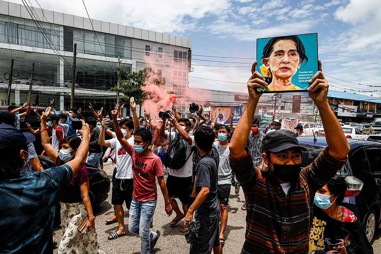 Protesters marking the birthday of Myanmar's detained civilian leader Aung San Suu Kyi, during a demonstration against the military coup in Yangon yesterday. The passage of the United Nations resolution occurred after the Secretary-General's special 