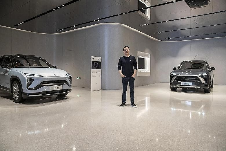 Mr Li at a Nio House, an elite drop-in centre for customers, in Shanghai in March. The carmaker also holds annual Nio Days and, at the first one in 2017, paid for flights and luxury hotels for everyone who ordered a vehicle a year before production s