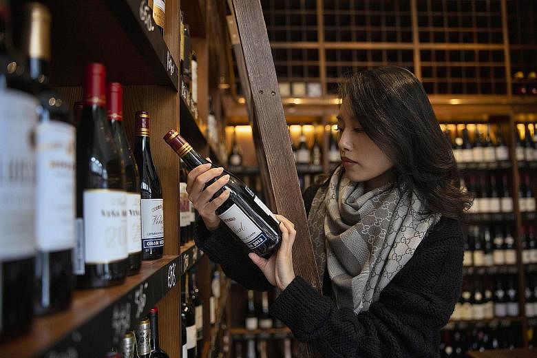 Imported wine being sold in a shop in Shanghai last year. Last November, China slapped tariffs of up to 218 per cent on Australian wines, which it said were being "dumped" in the Chinese market at subsidised prices. The crackdown virtually closed wha