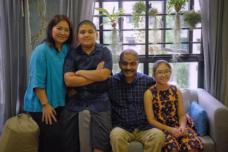 Civil servant Ganesan Maniam and his wife Kanjanalee with their daughter Jayashree and son Kavi at the family's "cosy corner" in their home in Choa Chu Kang, where they catch up on one another's lives every week. The bullying incident highlighted jus