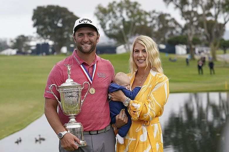 All in the family as Jon Rahm savours his US Open title with his wife and son.