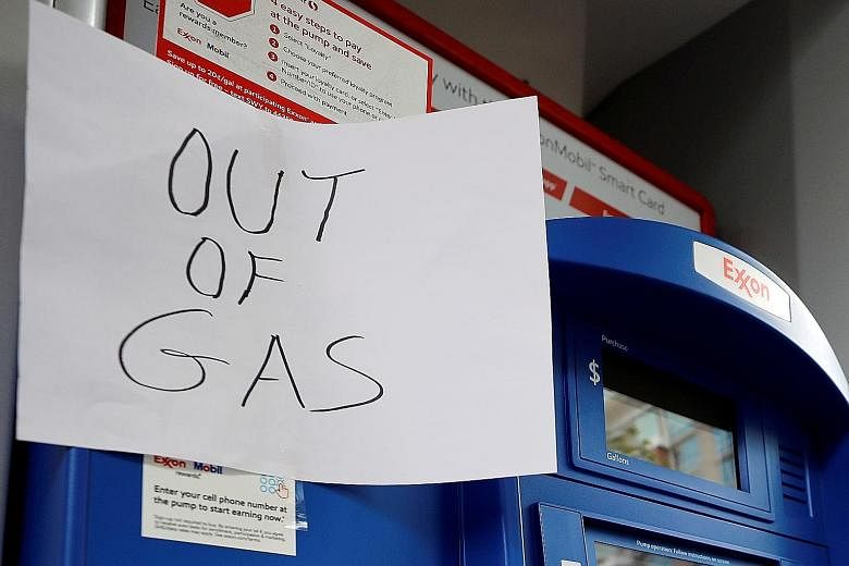 An "out of gas" sign displayed at an Exxon petrol station in Washington last month, after a cyber attack shut down Colonial Pipeline, the biggest fuel pipeline in the United States. PHOTO: REUTERS Above: Colonial Pipeline's Houston Station facility i