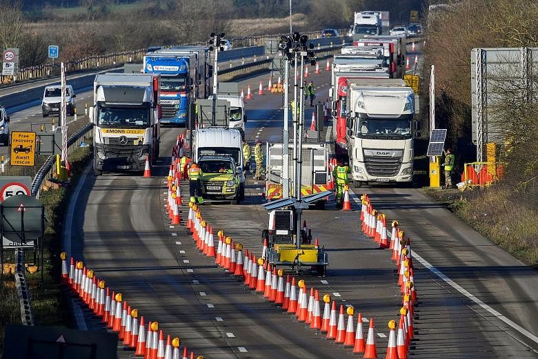 Lorries undergoing checks on the M20 motorway in Ashford, Britain, while heading towards the Eurotunnel bound for France, on Dec 31 last year. Britain seeks to deepen links with "fast-growing consumer markets beyond Europe"