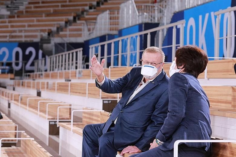 International Olympic Committee vice-president John Coates talking to Tokyo 2020 organising committee president Seiko Hashimoto during a visit to the Ariake Gymnastics Centre in Tokyo yesterday.