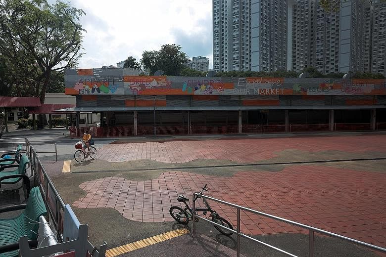 The area around 115 Bukit Merah View Market and Hawker Centre was quiet on Tuesday as customers stay away. The cluster there has attracted the most concern, having grown to 82 cases as at last night. It is now Singapore's largest open cluster, since 