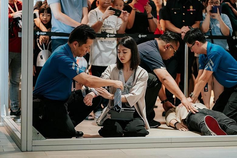 Participants in a simulated terror attack during an SGSecure roadshow at Punggol Waterway Point in 2019. Under the SGSecure programme, the proportion of residents with some emergency skills has increased from 40 per cent in 2017 to 62 per cent in 201