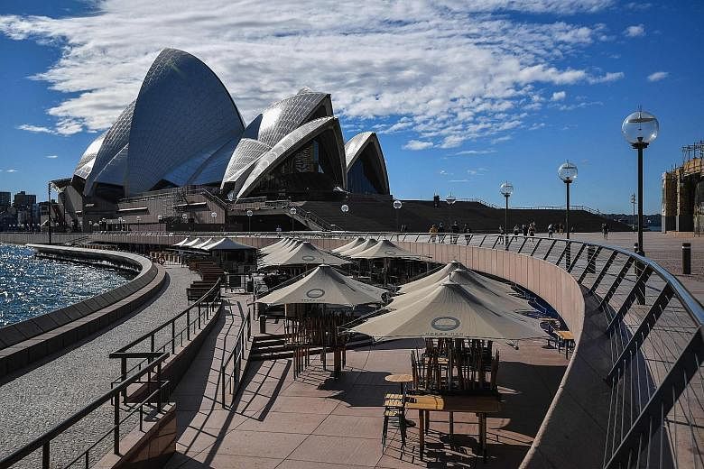 The Opera House in Sydney yesterday, after the authorities locked down Australia's largest city to contain an outbreak of the highly contagious Delta variant of the Covid-19 virus. PHOTO: AGENCE FRANCE-PRESSE
