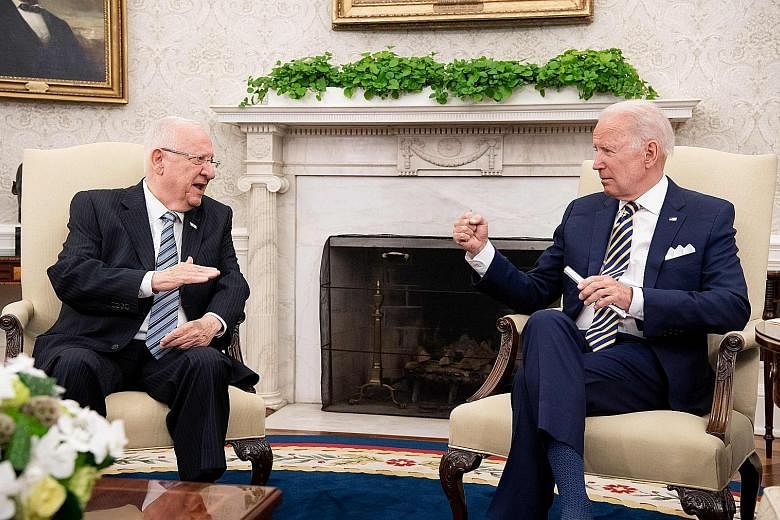 United States President Joe Biden (at right) at a meeting on Monday with visiting Israeli President Reuven Rivlin in the Oval Office of the White House, where Mr Biden said his commitment to Israel is iron-clad.