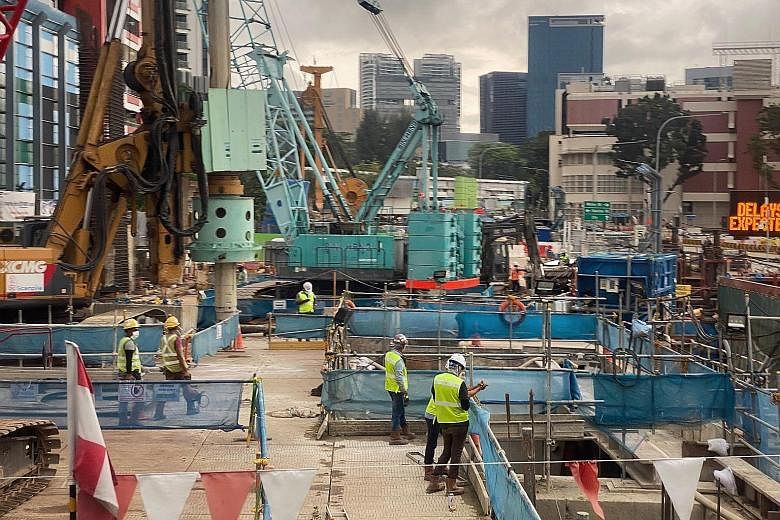 Workers at a construction site at Thomson Road on June 15. NTUC will work with affiliated unions to push for safety time-outs at all high-risk worksites, where site practices and risk assessments can be reviewed, said its assistant secretary-general 