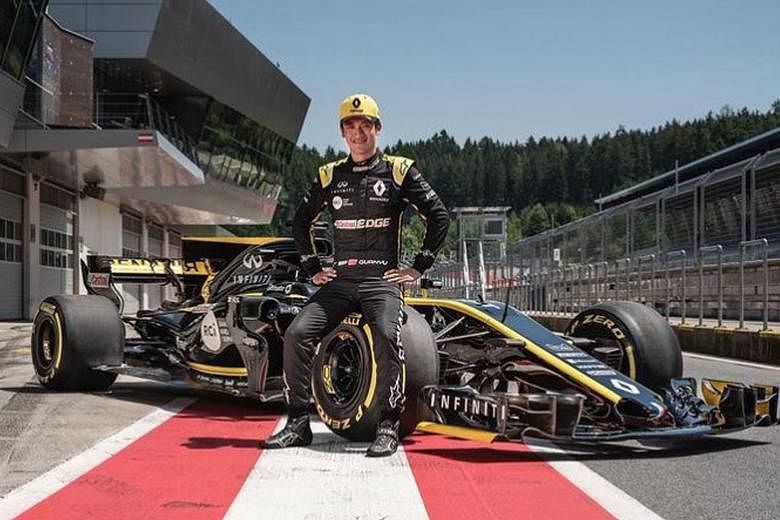 Alpine Academy's Zhou Guanyu posing with the Renault - now known as Alpine - F1 car in 2019. The 22-year-old is top of the F2 drivers' standings after three rounds and wants to be China's first F1 driver.