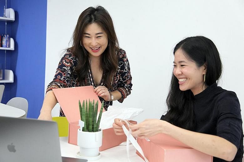 Ms Yang So-mang (far left) created an image analysis technology to allow users to custom-make shoes using their mobile phones and asked a former colleague, Singaporean Joanna Lam, to help market the shoes. PHOTO: KADA:KUDU