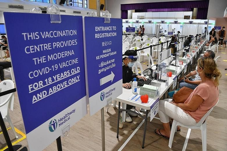 The Covid-19 vaccination centre at Radin Mas Community Club on Thursday. One key advisory guideline for employers is that they should not make vaccination mandatory for staff. ST PHOTO: CHONG JUN LIANG