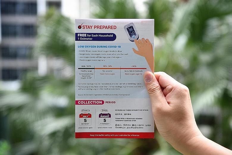 An example of the leaflets that were distributed via letterboxes to residents for them to collect their free oximeter. Temasek Foundation said it is unable to provide another leaflet. ST PHOTO: CHONG JUN LIANG