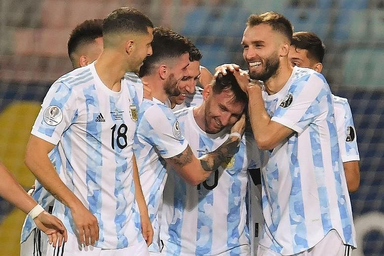Argentina's Lionel Messi (centre) celebrating with teammates after scoring against Ecuador in the Copa America quarter-final on Saturday. He made it 3-0 after assisting in the creation of the other goals.