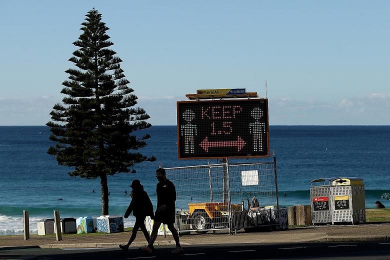 A deserted Bondi Beach in Sydney yesterday. New South Wales Premier Gladys Berejiklian said the state needed a vaccination rate of between 75 and 80 per cent to return to normality. Like other Australian states, however, it is nowhere near this targe