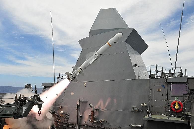 The Republic of Singapore Navy frigate RSS Tenacious firing a harpoon anti-ship missile during a coordinated strike with RSS Stalwart and RSAF fighters, in the waters off Guam during Exercise Pacific Griffin. PHOTO: MINDEF