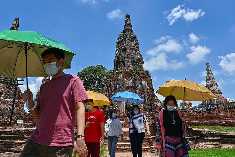 Visitors at the 17th-century Wat Chaiwatthanaram temple complex in Ayutthaya, north of Bangkok, last month. Thailand's small and medium-sized enterprises, many of them concentrated in the tourism industry, have been hit especially hard since the coun