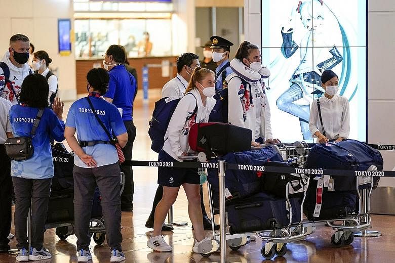 Britain's Olympic Team members arriving at Tokyo International Airport in Haneda yesterday. The absence of crowds at Tokyo 2020 will likely further strain the Games' budget, with ticket revenues expected to dwindle to close to zero.