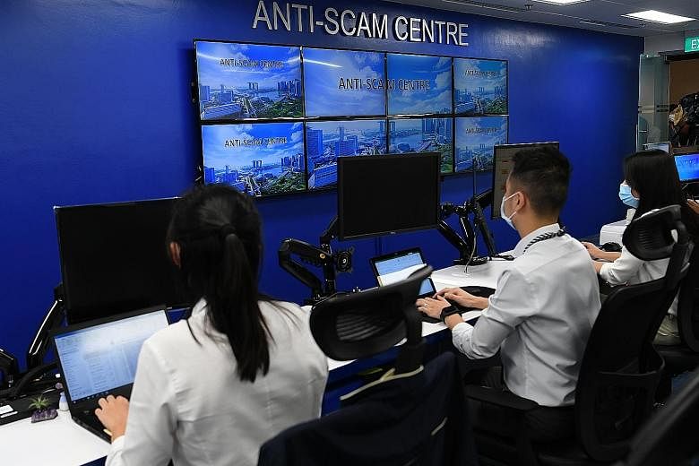 Officers at the Singapore Police Force's Anti-Scam Centre. Project Frontier, a collaboration between the Anti-Scam Centre and more than 30 financial institutions, online marketplaces and telecommunication service providers, helps in swift interceptio