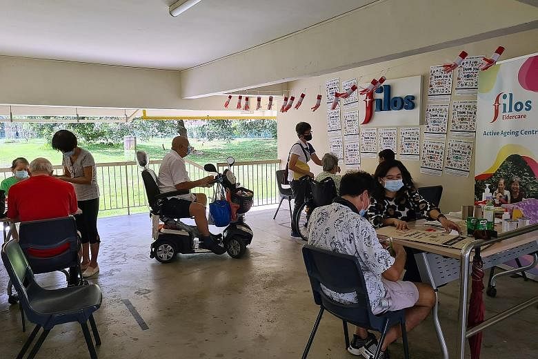 Elderly beneficiaries doing art and craft with volunteers at Filos Community Services' new active ageing centre in Chai Chee Drive. The centre will follow a population-based model which gives all seniors access to services regardless of their income 