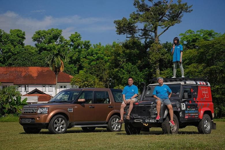 Mr Larry Leong, with wife Simone and daughter Lucy, will be scrapping his 20-year-old Land Rover Defender 90 (right) in less than a month. He bought a second-hand Discovery 4 (left) last December for $121,000.