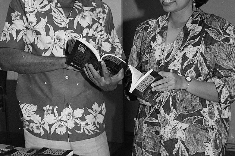 (Top) Former minister of social affairs Othman Wok flipping through his book, Malayan Horror, with his daughter Lily Othman at its launch in 1991. A Mosque In The Jungle (above) is a new compilation of his stories.