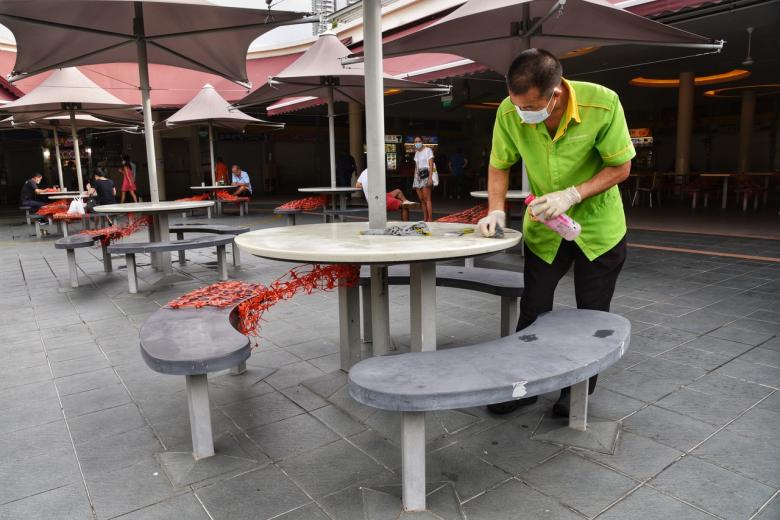 Hawkers cautiously dinein for groups of five The Straits Times