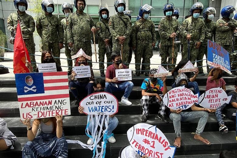 Filipino protesters outside the Chinese consular office in Manila yesterday, the fifth anniversary of an international tribunal ruling rejecting much of Beijing's claim to the South China Sea.