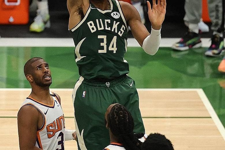 Bucks forward Giannis Antetokounmpo becoming only the third player after Shaquille O'Neal in 2000 and LeBron James in 2016 to notch back-to-back 40-point, 10-rebound games in an NBA Finals.
