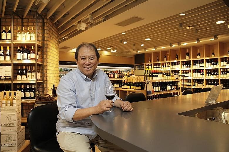 The late wine retailer Don Tay in August 2016 at his Bacchus outlet in the now-defunct Isetan department store at Westgate mall.