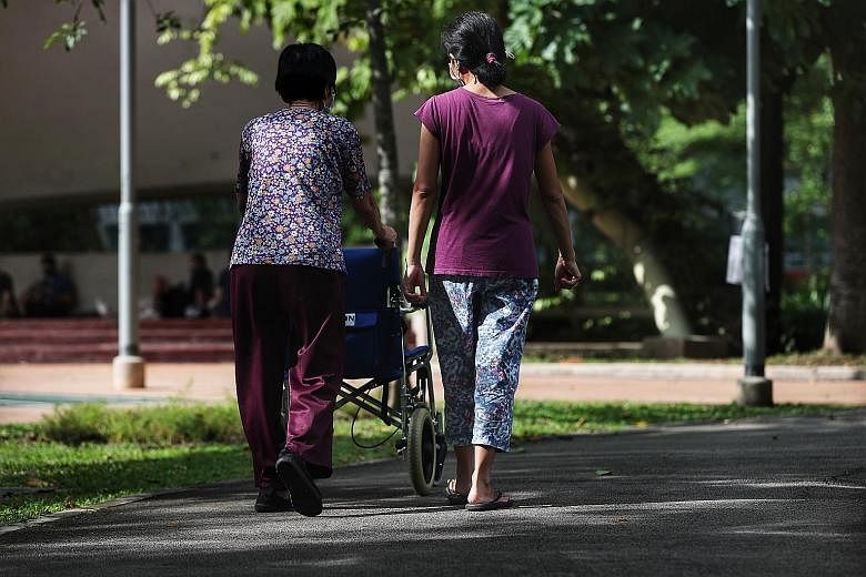 Employers with levy concessions - granted to those who live with Singaporean young children, the elderly or people with disabilities - will be prioritised under the pilot scheme, which involves an intensive testing regime. ST FILE PHOTO