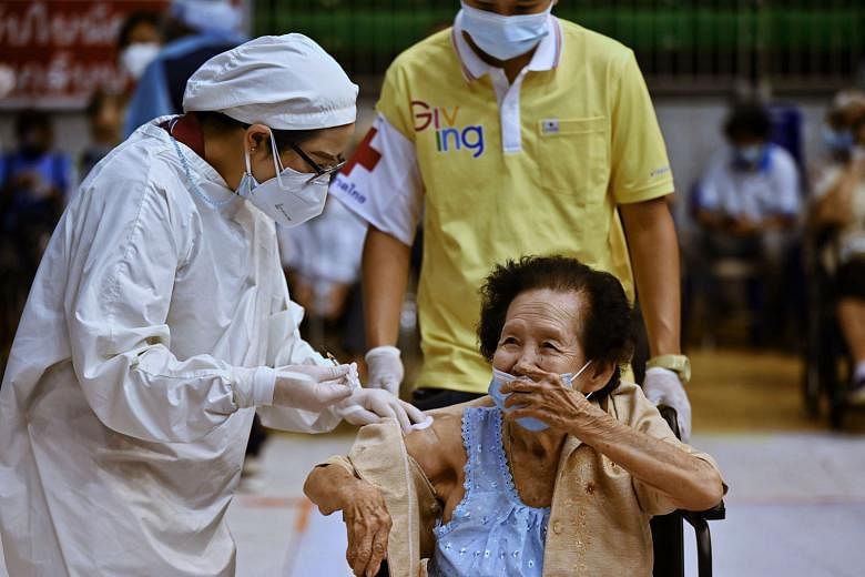 A new preliminary Thai study has raised doubts about the longer-term efficacy of CoronaVac, the vaccine developed by Sinovac. A health worker administering the AstraZeneca vaccine to a resident at a sports stadium in Phuket late last month. Thailand 
