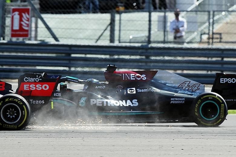 Lewis Hamilton of Mercedes, who started second on the grid, giving chase to Red Bull's Max Verstappen, before the Dutchman hit the front tyre of the Mercedes and crashed out of the race.