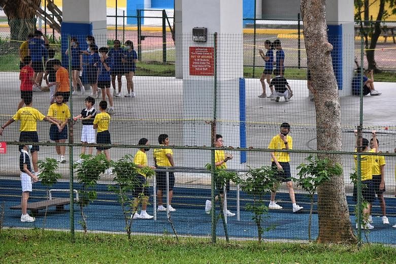 Beatty Secondary School students having a physical education class on July 6. From today, such lessons should be class-based, and consist of individual or group activities up to a limit of two people.