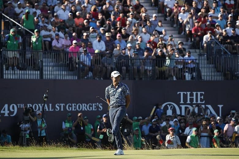 American golfer Collin Morikawa reacting on the 18th green at the British Open on Sunday. The 24-year-old won by two strokes with a 15-under 265 total and is the first men's player to win two different Majors in his first appearance.