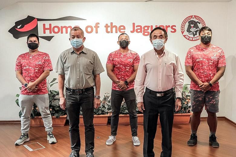 Mr Vincent Lim (fourth from left), who collapsed while jogging, with the men who rushed to attend to him (from left) Mr Del Moro Dennis Ranido, Mr Loy Kwong Choy, Mr Mohammad Azhar Abdullah Sani and Mr Mohamad Noriman Bahtiar at the 4th SCDF Division