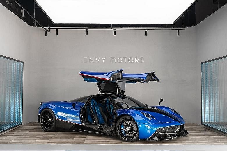 FRONT FOR FRAUD Investors would enter into agreements with Ng's Envy Global Trading (above) or Envy Asset Management to fund purported nickel purchases. LAVISH LIFESTYLE A rare multimillion-dollar Pagani Huayra hypercar was among Ng's assets seized b