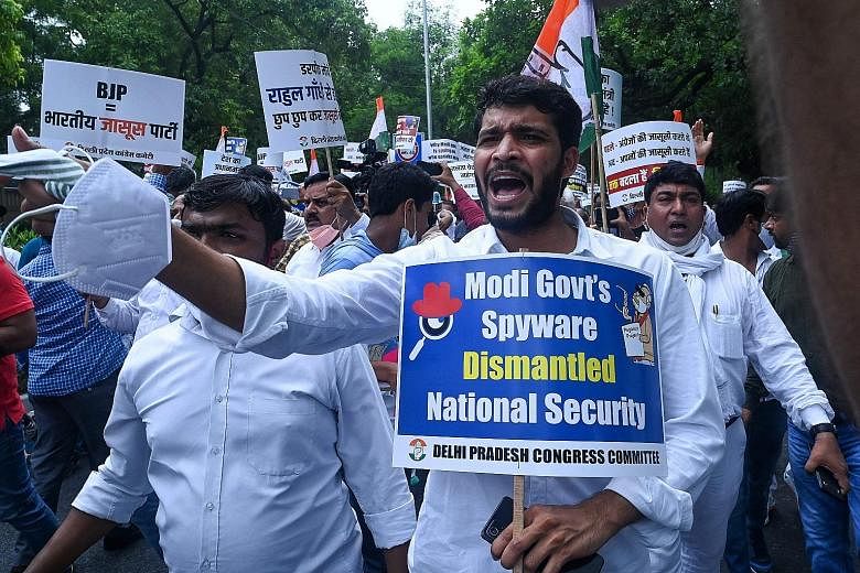 India's Congress party members protesting in New Delhi yesterday against Prime Minister Narendra Modi's government over its alleged surveillance operation using the Pegasus spyware.