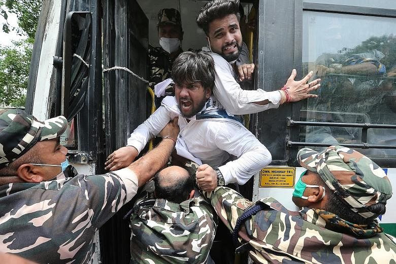 Indian Youth Congress activists protesting against the Indian government over the alleged phone tapping of journalists and politicians, in New Delhi on Tuesday. There have been allegations that Pegasus was used by the government to engineer the fall 