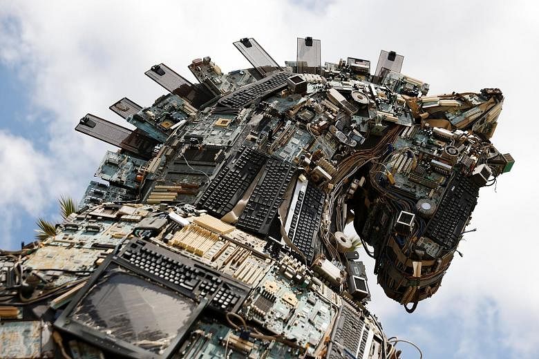 The head of a Cyber Horse exhibit, constructed with used computer and mobile phone parts infected by viruses and malware, is displayed near the entrance to the Cyber Week conference at Tel Aviv University in Israel yesterday. Israel-based creative gr
