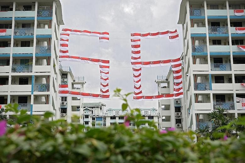 Eye-catching flag displays have been going up in various neighbourhoods across Singapore in the lead-up to National Day on Aug 9. In this estate in Toa Payoh Lorong 1, a large display of flags making up the number 56 hangs between two blocks of flats