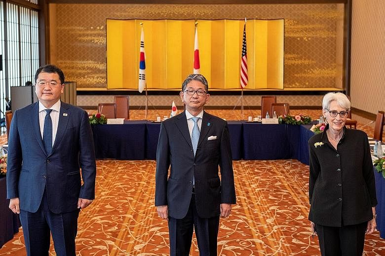 (From left) South Korea's Vice-Foreign Minister Choi Jong-kun, Japan's Vice-Minister for Foreign Affairs Takeo Mori and US Deputy Secretary of State Wendy Sherman at their meeting in Tokyo yesterday. PHOTO: REUTERS